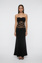 Victoria black lace evening gown with a mermaid hem from Lumina Wear, featuring a fitted silhouette and intricate lace details.