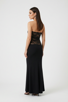 Elegant black lace evening gown with a mermaid hem by Lumina Wear, featuring a fitted bodice and flowing skirt.