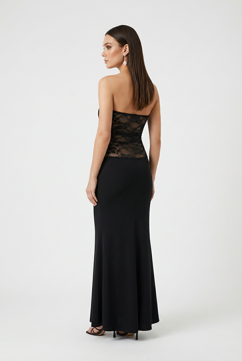 Elegant black lace evening gown with a mermaid hem by Lumina Wear, featuring a fitted bodice and flowing skirt.