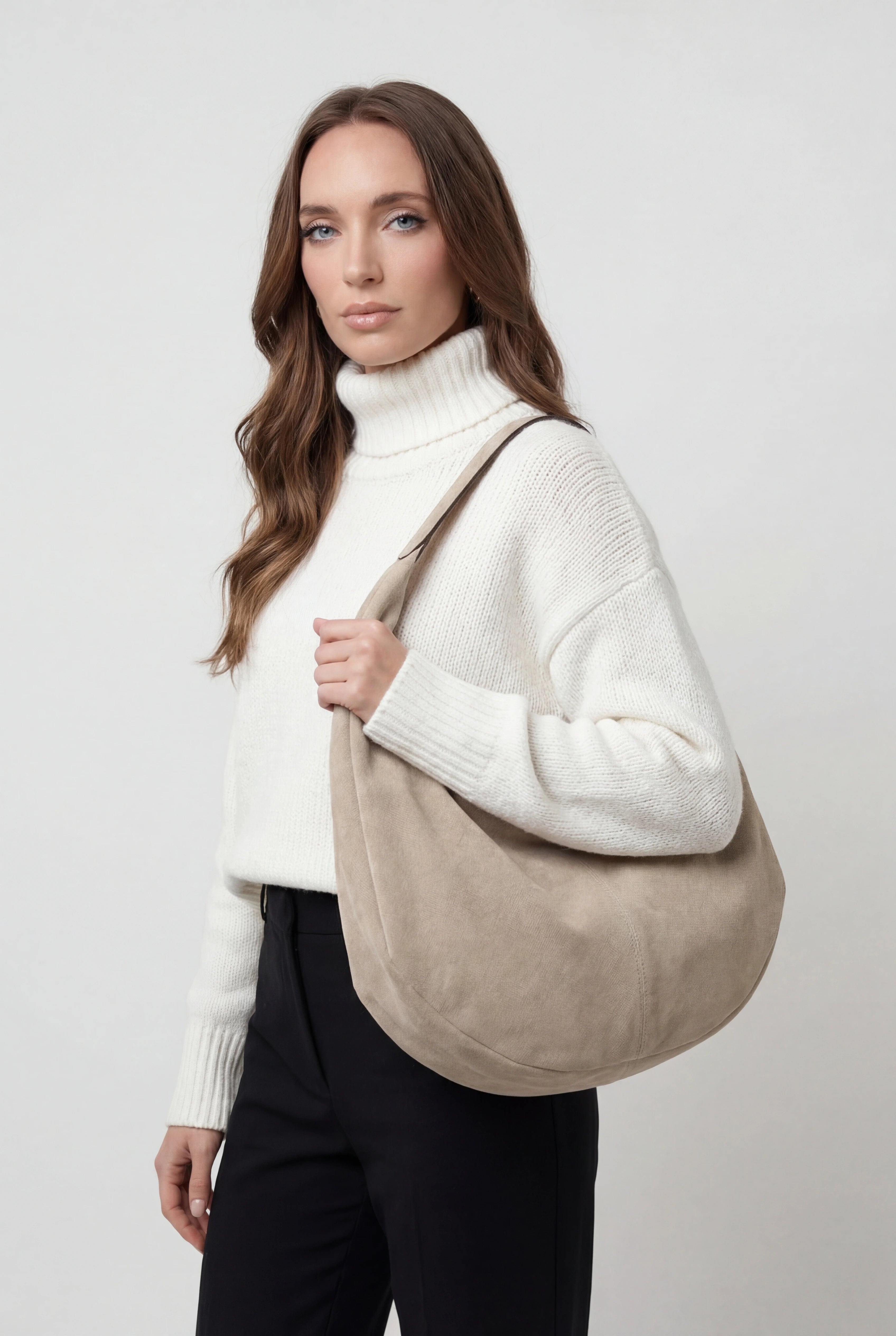 Elegant black suede Victoria Lumina Wear hobo handbag with multiple pockets, featuring a stylish and spacious design for everyday use.