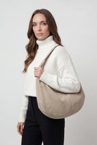 Elegant black suede Victoria Lumina Wear hobo handbag with multiple pockets, featuring a stylish and spacious design for everyday use.