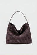 Elegant black suede tote bag by Lumina Wear featuring a spacious design and structured hand-held style.