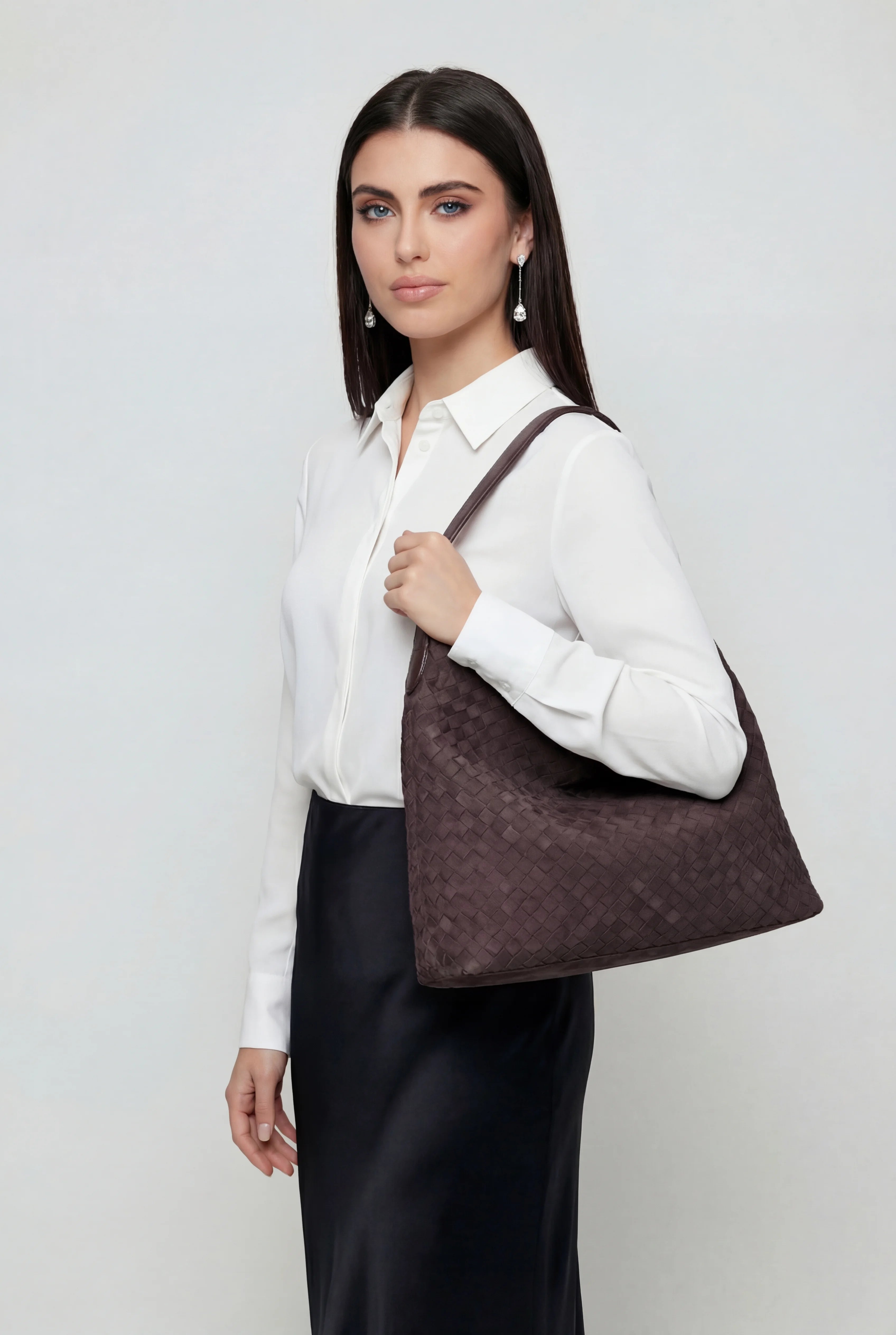 Elegant black suede tote bag by Lumina Wear featuring a spacious design, perfect for stylish everyday use.