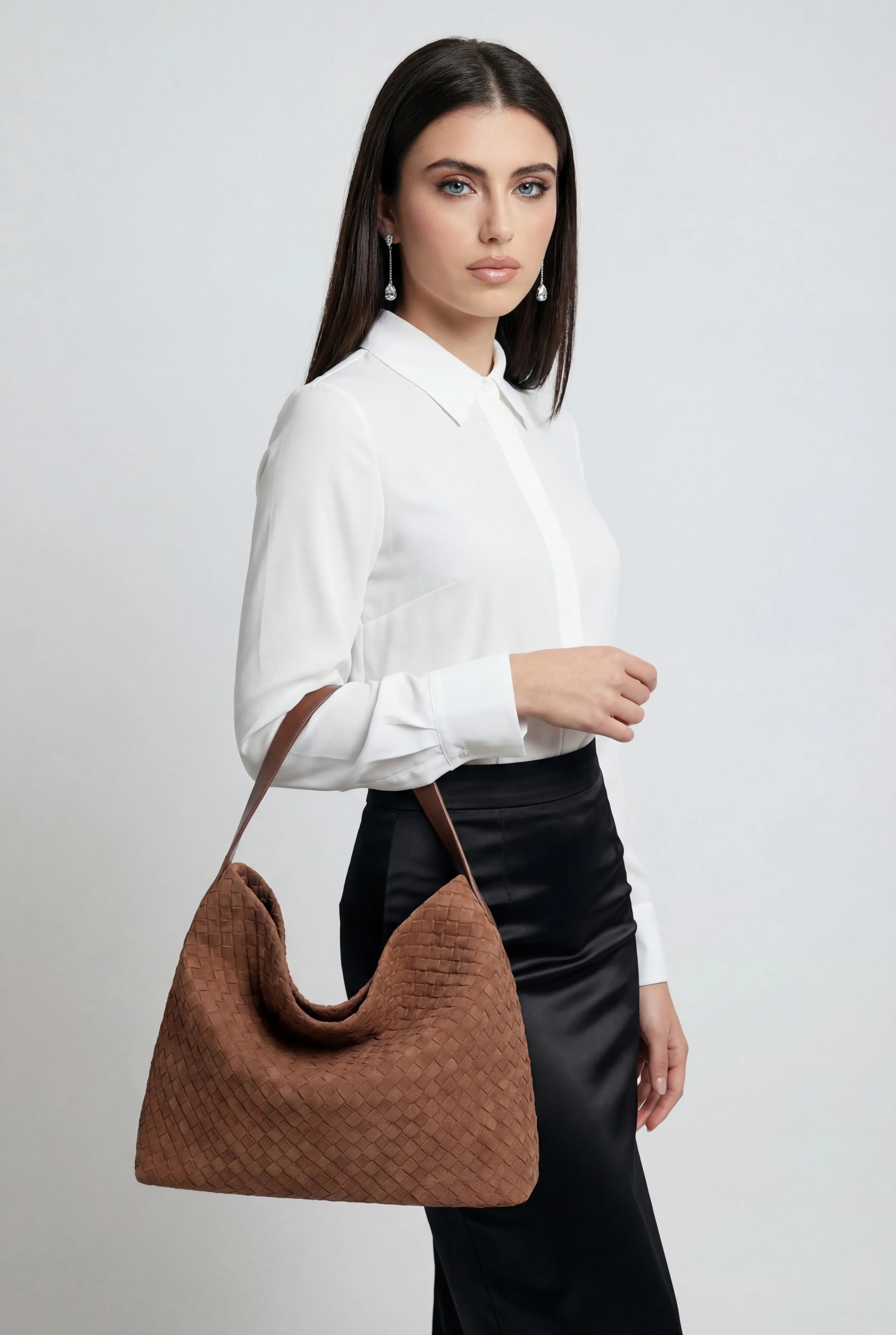 Elegant black suede tote bag by Lumina Wear featuring a roomy design, perfect for stylish everyday use.