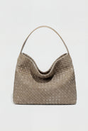 Elegant black suede tote bag by Lumina Wear featuring a spacious design and stylish hand-held silhouette.