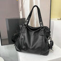 Elegant black Lumina Wear tote bag with spacious interior, featuring sleek design and sturdy handles.