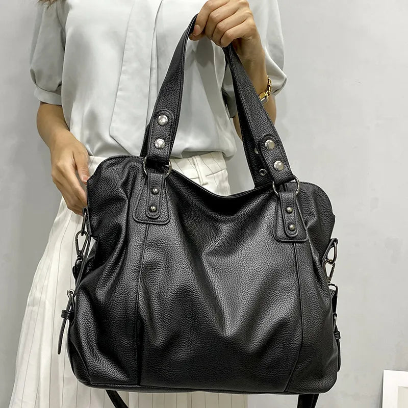 Elegant black tote bag by Lumina Wear featuring a spacious design and sleek silhouette, perfect for everyday use.