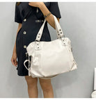 Black Lumina Wear Victoria tote bag with spacious interior, elegant design, and sturdy handles, perfect for daily use.
