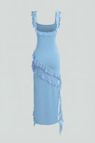 Elegant blue Victoria evening maxi dress by Lumina Wear with a high slit, flowing fabric, and stylish design for formal occasions.