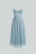 Elegant blue midi wedding guest dress by Lumina Wear featuring a flattering silhouette and stylish design.
