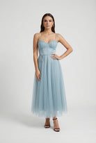 Elegant blue midi wedding guest dress by Lumina Wear, featuring a flattering silhouette and stylish design.