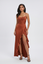 Elegant brick red dress by Lumina Wear featuring a lace-up back, styled on a model showcasing the dress's fit and design.