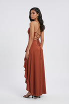 Victoria brick red dress with lace-up back by Lumina Wear, featuring elegant design and fitted silhouette.