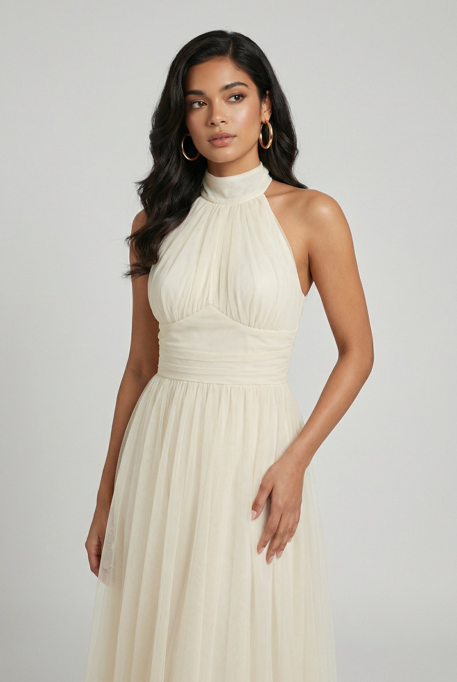 Elegant cream midi dress by Lumina Wear featuring a flowy design, perfect for stylish occasions.