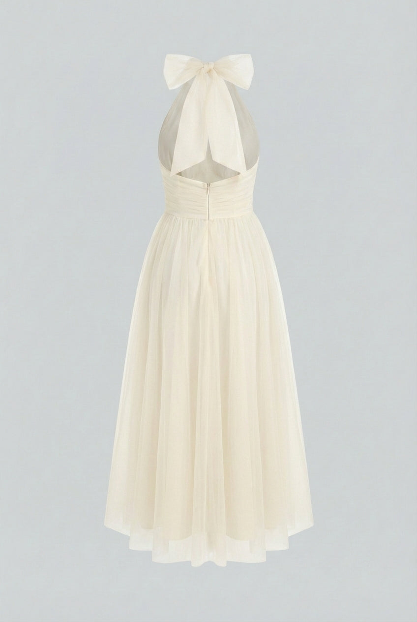 Elegant cream midi dress by Lumina Wear featuring a flowy design, perfect for sophisticated occasions.