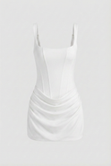 White Victoria Lumina Wear mini dress featuring elegant draping and an hourglass silhouette for women.