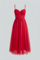 Red Victoria Lumina Wear elegant flowy A-line midi dress displayed on a hanger, showcasing its stylish silhouette and vibrant color.