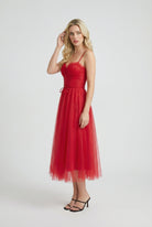 Red Victoria Lumina Wear elegant flowy A-line midi dress, showcasing a stylish and comfortable design for special occasions.