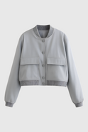 Gray Victoria bomber jacket by Lumina Wear featuring a sleek, timeless design and modern fit, shown on a model.