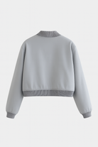 Elegant gray bomber jacket from Lumina Wear featuring a timeless design, showcased on a model with a neutral background.
