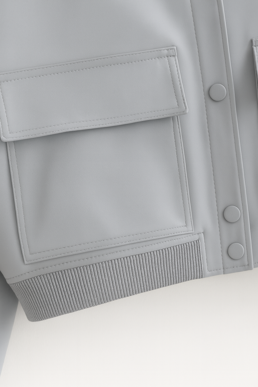 Elegant gray bomber jacket from Lumina Wear featuring a timeless design and stylish fit, shown in a close-up image.