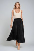Gold high-waist pleated maxi skirt by Lumina Wear, featuring elegant flowing fabric and a stylish, floor-length design.