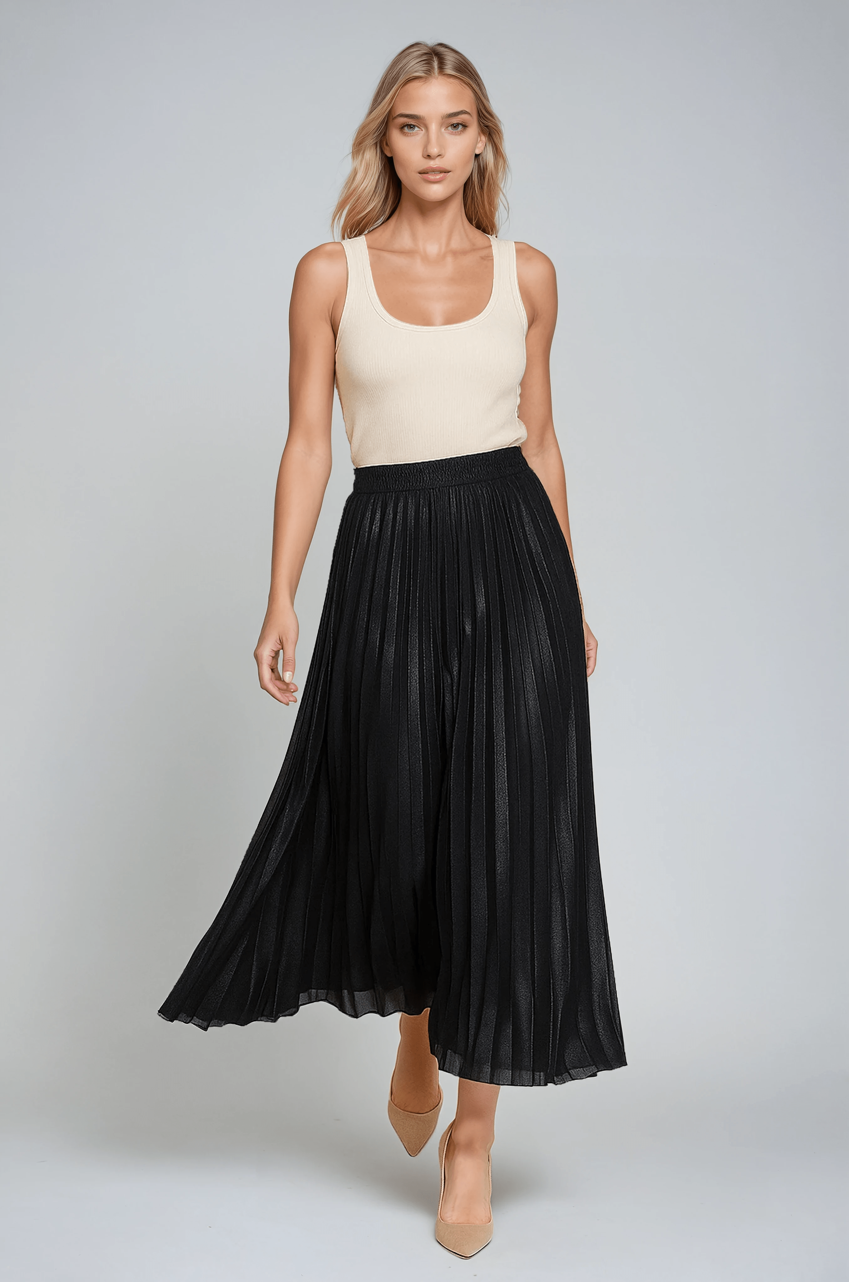 Gold high-waist pleated maxi skirt by Lumina Wear, featuring elegant flowing fabric and a stylish, floor-length design.