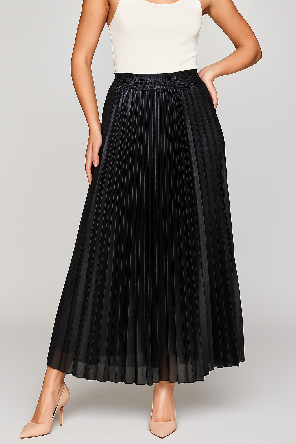 Gold high-waist pleated maxi skirt by Lumina Wear, elegant and flowing, showcased in a stylish fashion photo.
