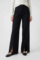 Elegant black high-waisted women's trousers with pleats by Lumina Wear, featuring a tailored fit and classic design.