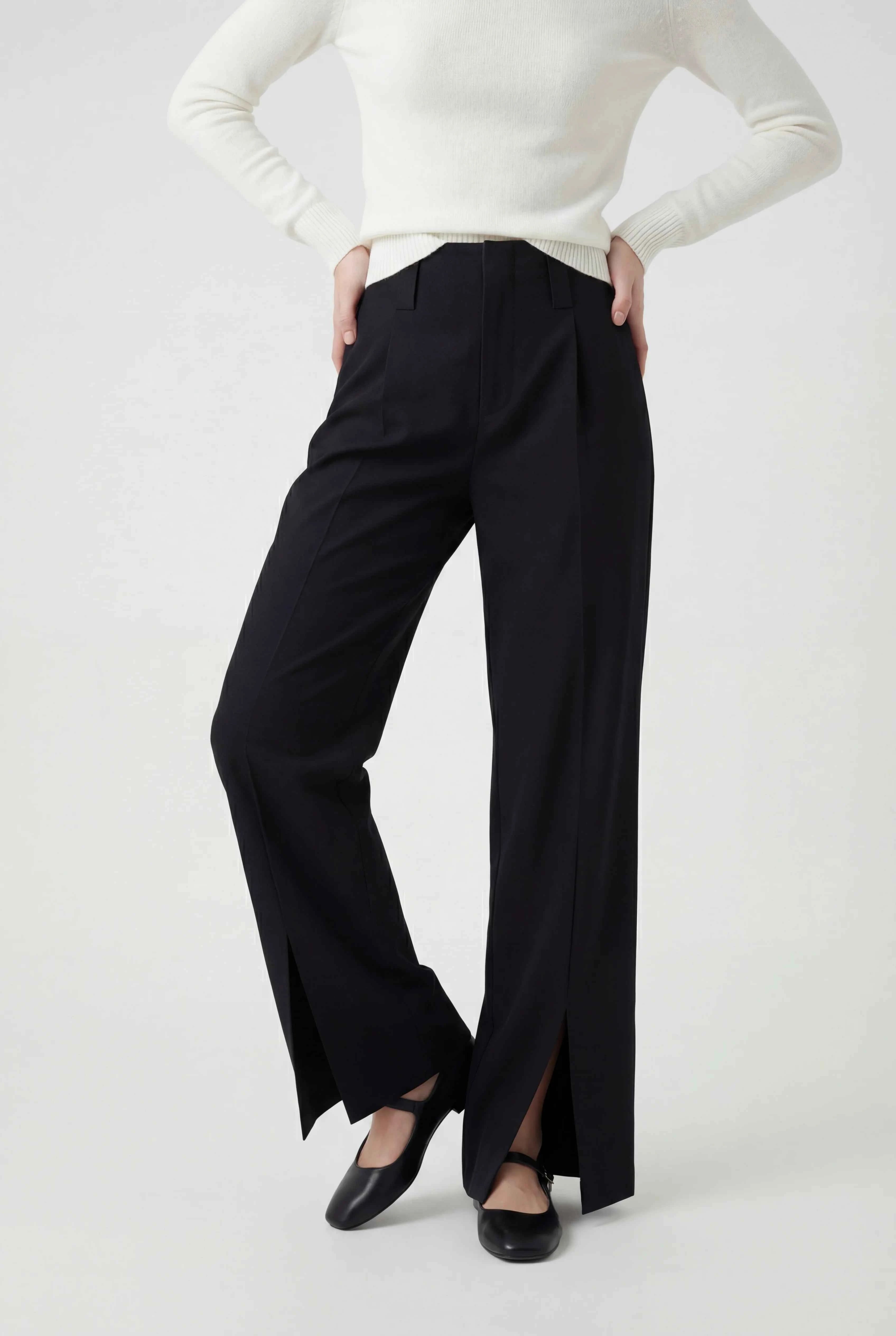 Elegant black high-waisted women's trousers with pleats from Lumina Wear, featuring a tailored fit and classic style.