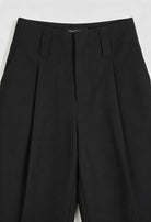Women's black high-waisted trousers with pleats from Lumina Wear, featuring a sleek, elegant fit and tailored design.