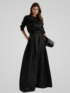 Black Victoria high-waisted trouser skirt with A-line cut by Lumina Wear, showcasing a sleek, elegant silhouette.