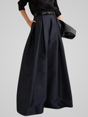 Black Victoria high-waisted trouser skirt with A-line cut from Lumina Wear, styled with a sleek, elegant silhouette.