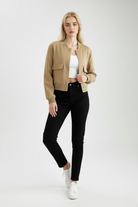 Victoria Lumina Wear khaki bomber jacket with a loose fit, stylish and elegant, shown on a model with minimal accessories.