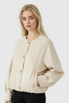 Lumina Wear Victoria khaki short jacket for women with O-neck and long sleeves, stylish and elegant outerwear.