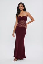 Wine red Victoria lace mermaid wedding dress with corset back by Lumina Wear, showcasing intricate lace details and elegant silhouette.
