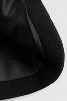 Victoria Lumina black lightweight windbreaker jacket with flattering fit, shown on a model with a stylish, sleek design.