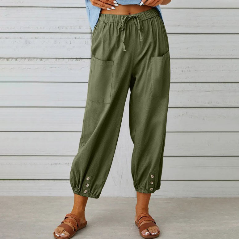 White Victoria Lumina Wear lightweight wide-leg trousers with a relaxed fit, styled for elegant, comfortable wear.