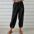 White Victoria Lumina Wear lightweight wide-leg trousers with a relaxed fit, shown on a model against a neutral background.