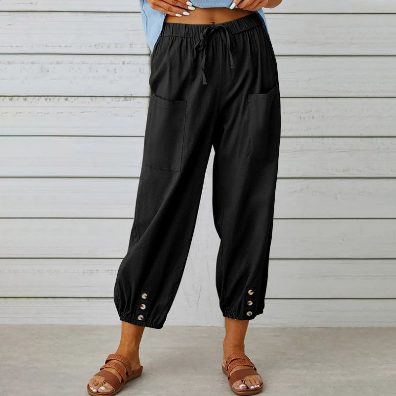White Victoria Lumina Wear lightweight wide-leg trousers with a relaxed fit, shown on a model against a neutral background.