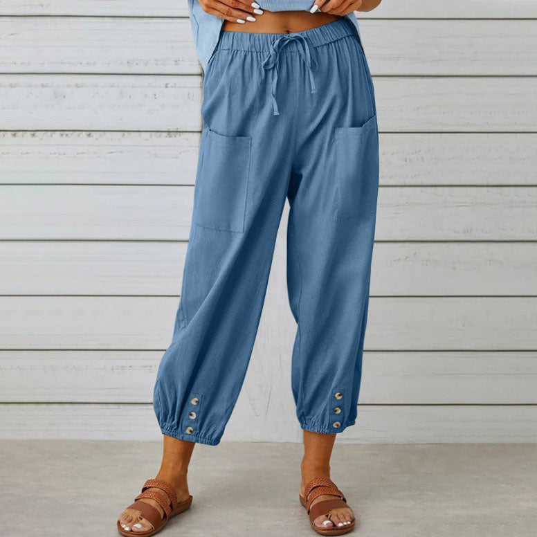 Victoria Lumina Wear lightweight wide-leg trousers in white, styled with a relaxed fit and elegant design.