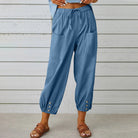Victoria Lumina Wear lightweight wide-leg trousers in white, styled with a relaxed fit and elegant design.