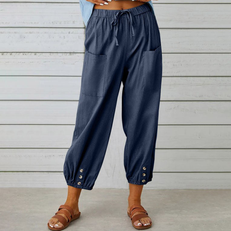 White Victoria Lumina Wear elegant lightweight wide-leg trousers displayed on a model, showcasing a relaxed fit and stylish design.