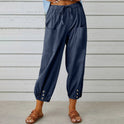 Victoria Lumina Wear lightweight wide-leg trousers in white, showcasing their elegant, flowy design and comfortable fit.