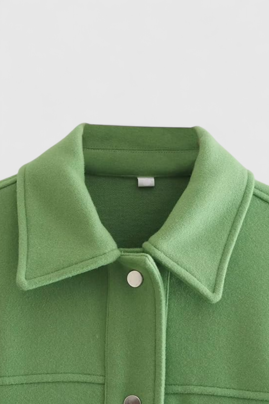 Green Victoria Lumina Wear elegant long sleeve jacket with button closure, stylish and tailored for a sophisticated look.