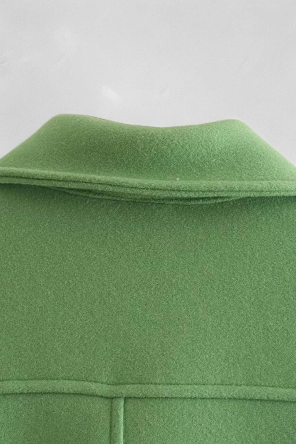 Lumina Wear Victoria elegant green long sleeve jacket with button closure, stylish and tailored for a sophisticated look.