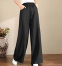 Black Victoria loose-fitting trousers from Lumina Wear with a chic, elegant design, perfect for stylish, comfortable everyday wear.