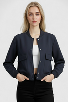 Elegant navy bomber jacket by Lumina Wear, featuring a timeless design and classic fit, shown on a model.