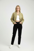 Elegant olive green bomber jacket by Lumina Wear with a timeless design, shown on a model highlighting the stylish fit.