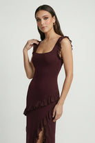 Lumina Wear Victoria maxi dress featuring an elegant open-back design and flattering silhouette in brown.